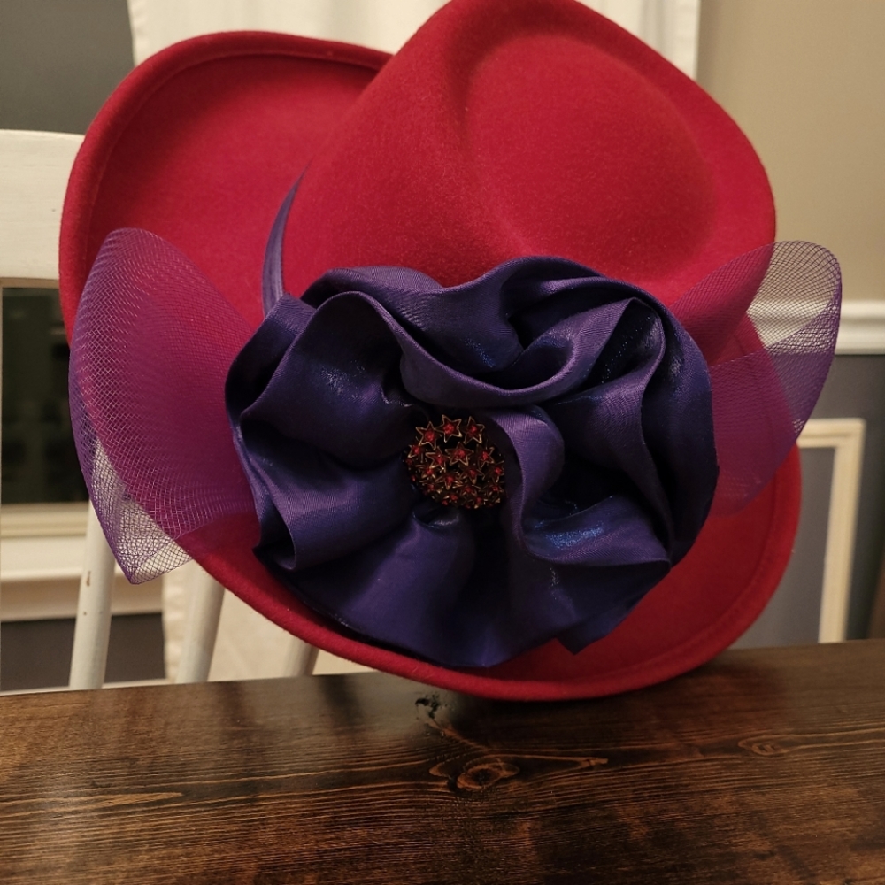 Red wool fedora hat with purple bow and red brooch
